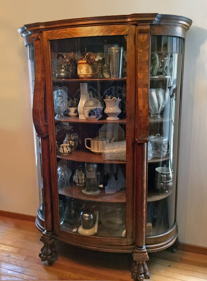 Appraisal: OAK TRIPLE BOW CHINA CABINET Shaped top bowed glass door