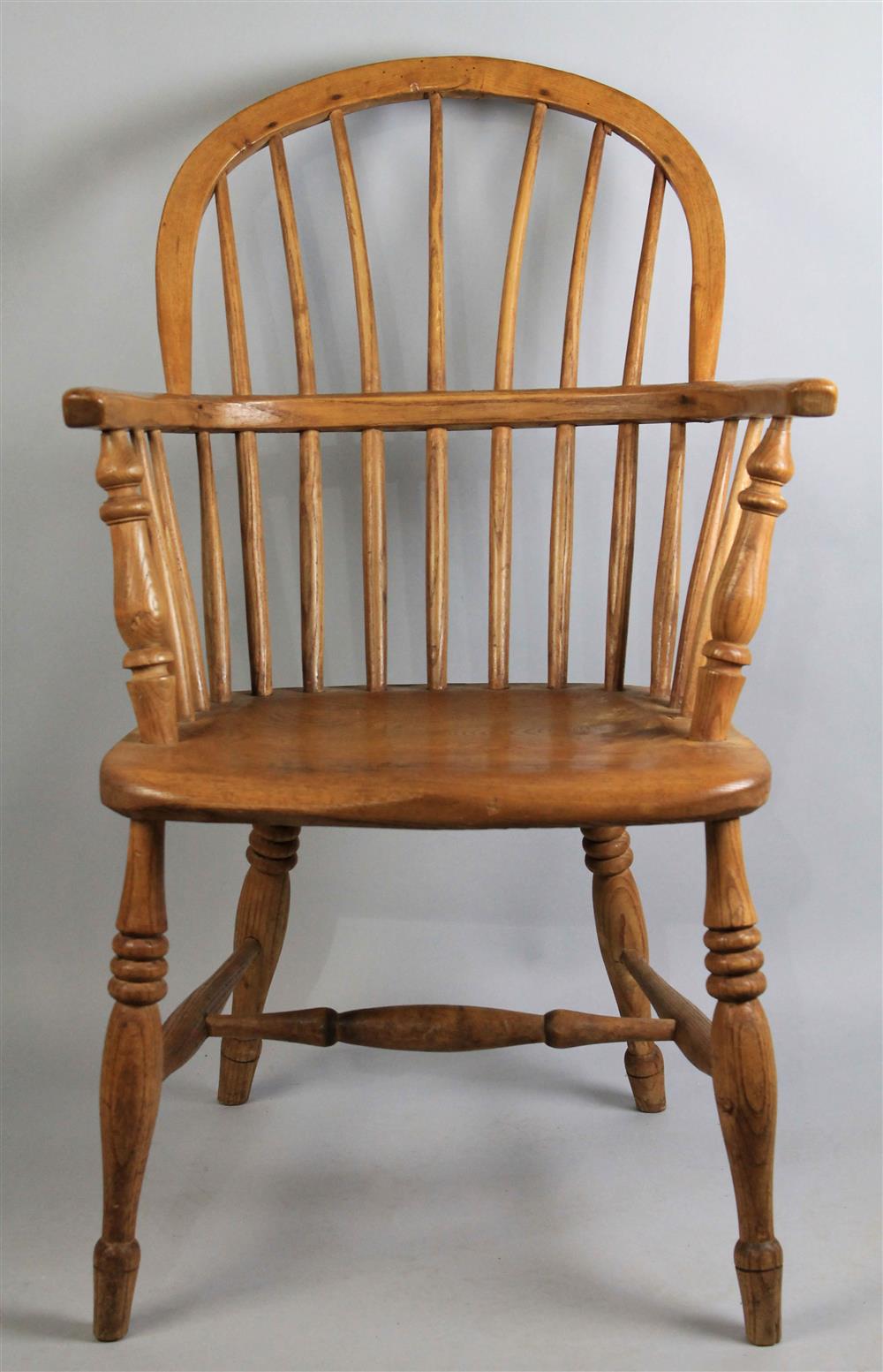 Appraisal: ENGLISH WINDSOR ARMCHAIR the bow back above conforming seat raised