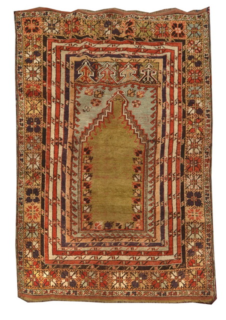 Appraisal: A TURKISH PRAYER RUG the central green ground panel within