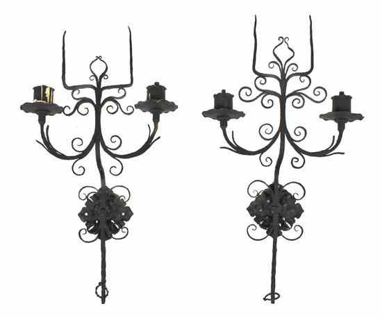 Appraisal: A Pair of Continental Wrought Iron Two-Light Wall Scones having