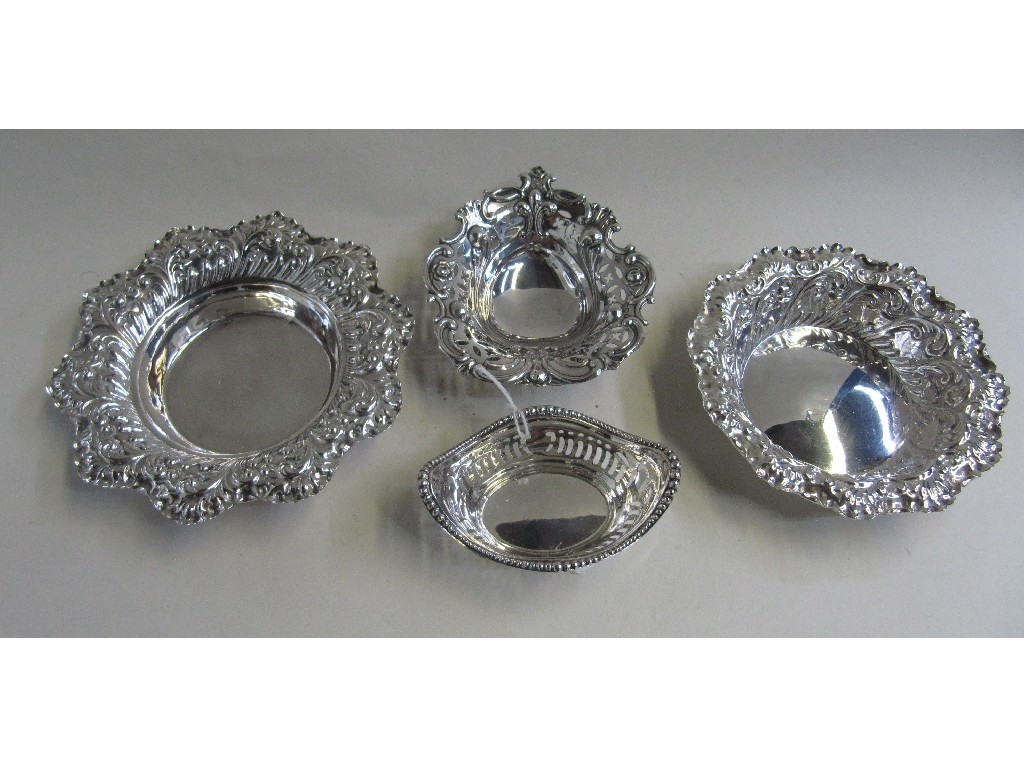 Appraisal: Lot comprising graduated pair of silver bon bon dishes and