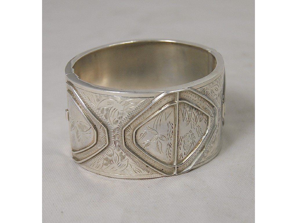 Appraisal: Silver wide cuff bangle hinged half engraved Victorian style