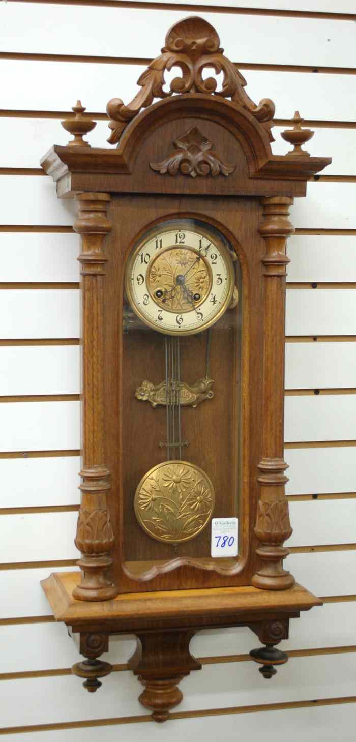 Appraisal: AN OAK AND GLASS CASED WALL CLOCK German c having