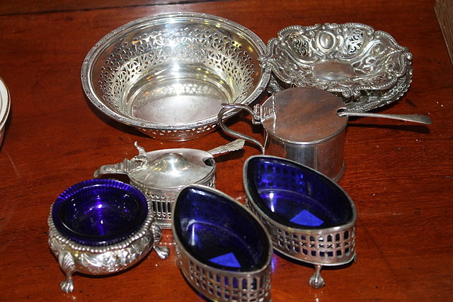 Appraisal: A PAIR OF GEORGIAN SILVER OVAL SALTS with blue glass