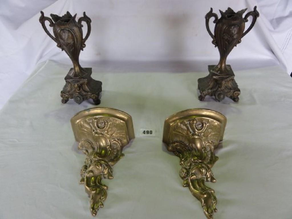 Appraisal: A pair of cast brass wall brackets in a Rococo