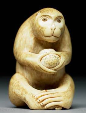 Appraisal: ANTIQUE IVORY NETSUKE Antique carved ivory netsuke of a monkey