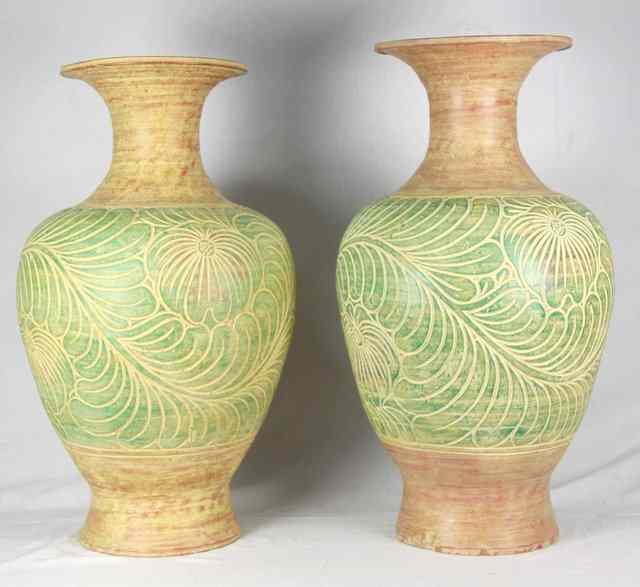 Appraisal: A pair of large ceramic vases modern incised in relief