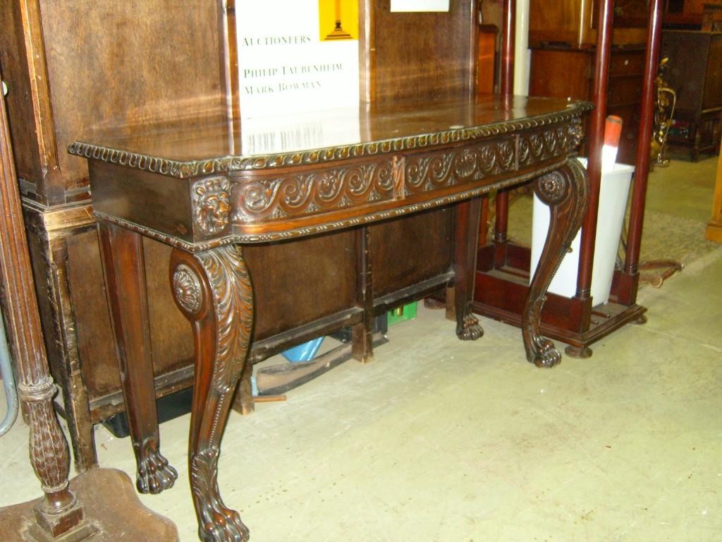 Appraisal: A Regency mahogany serving table raised on cabriole forelegs with