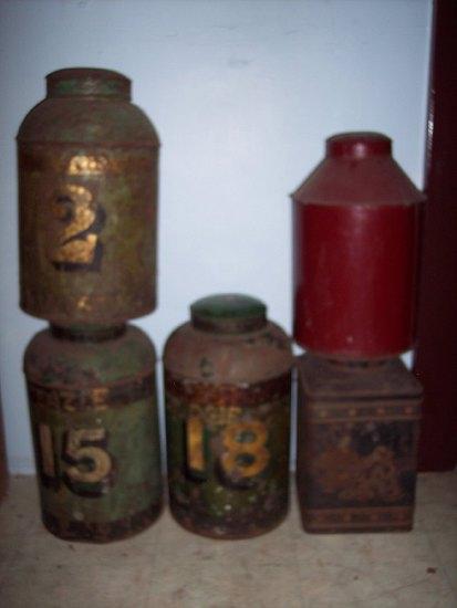 Appraisal: Three cylindrical tea cannisters with covers cm high another cm