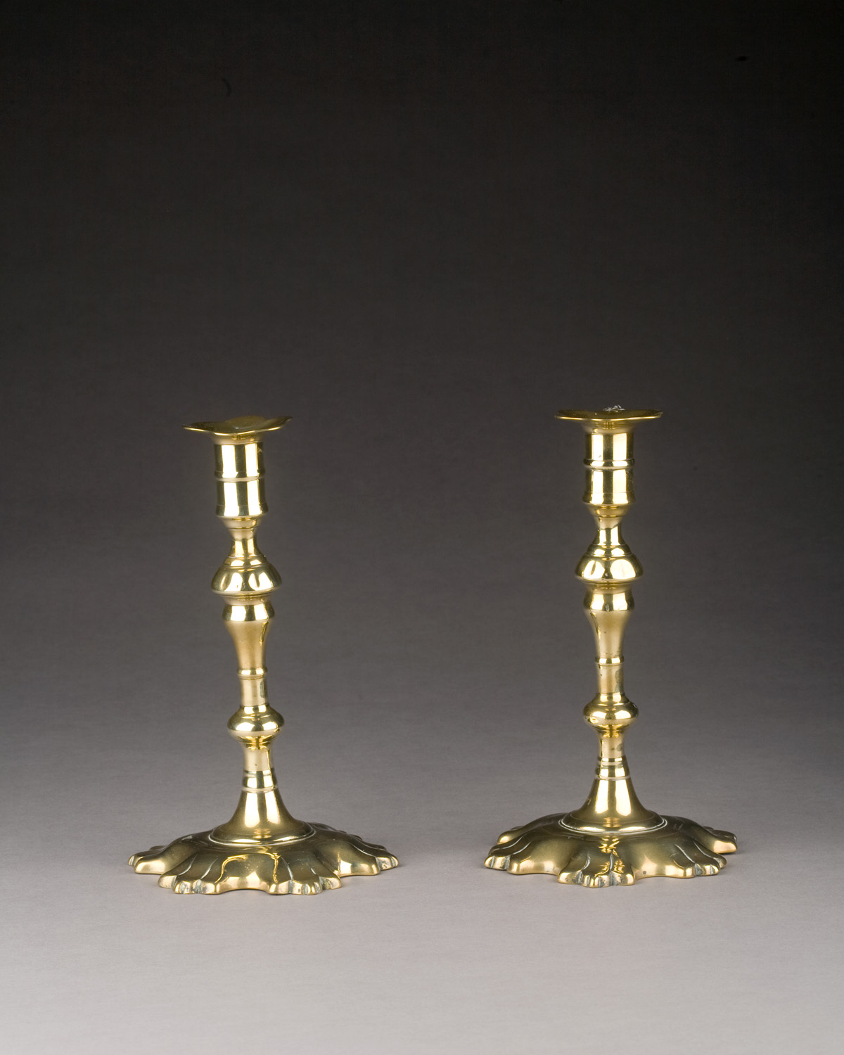 Appraisal: RARE PAIR OF GEORGE II BRASS CORE-CAST CANDLESTICKS CIRCA Each