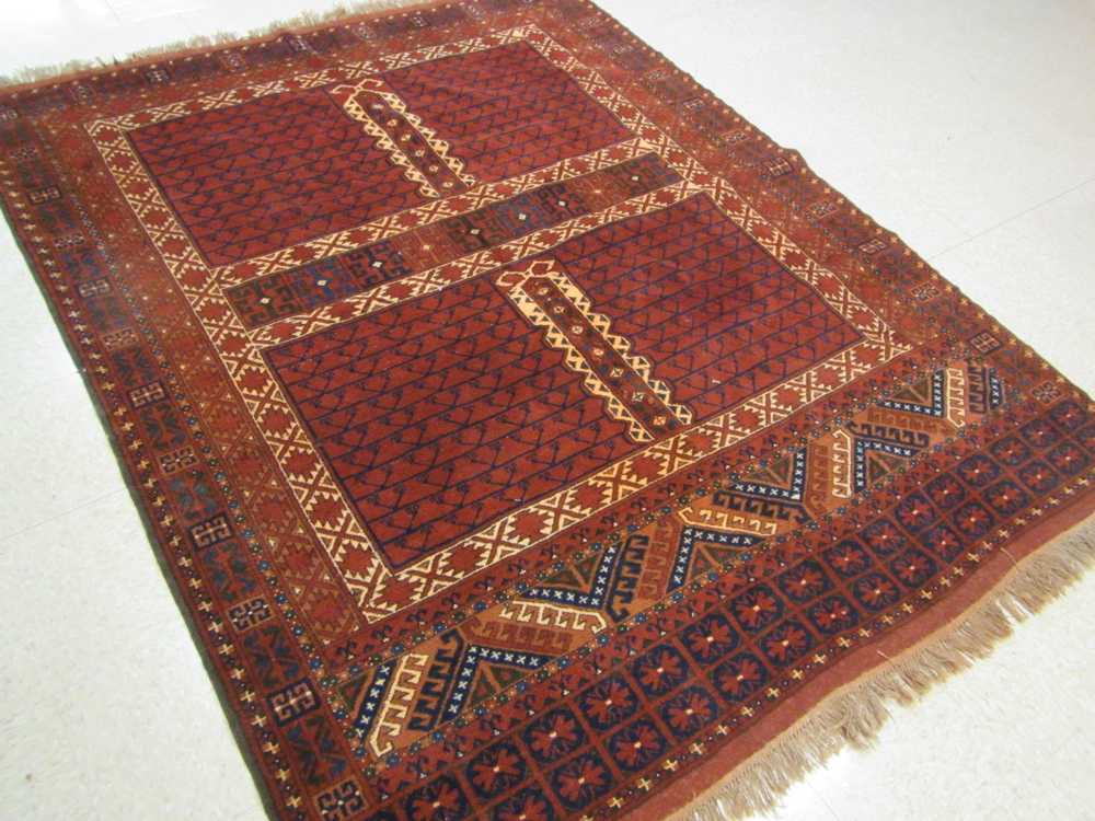 Appraisal: AFGHAN TURKOMAN ENSI CARPET hand knotted in a four panel