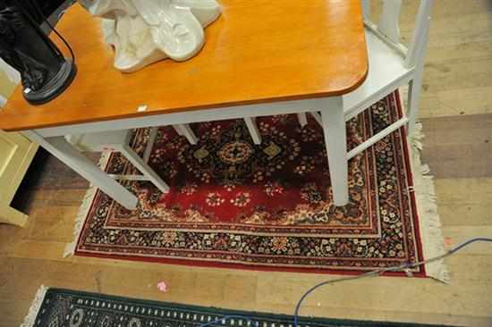 Appraisal: A PERSIAN FLOOR RUG IN RED BLUE AND CREAM TONES