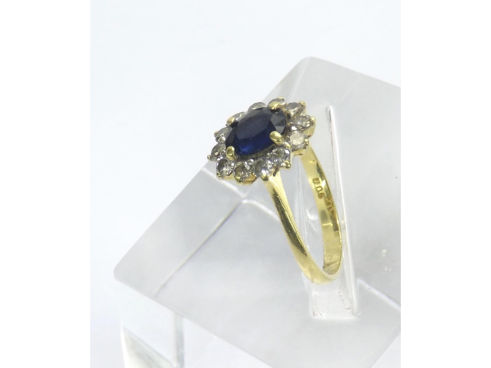 Appraisal: ct sapphire and diamond oval cluster ring the central sapphire