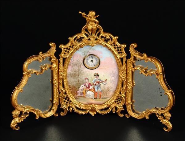 Appraisal: A Continental gilt metal and enamel triptych boudoir table timepiece