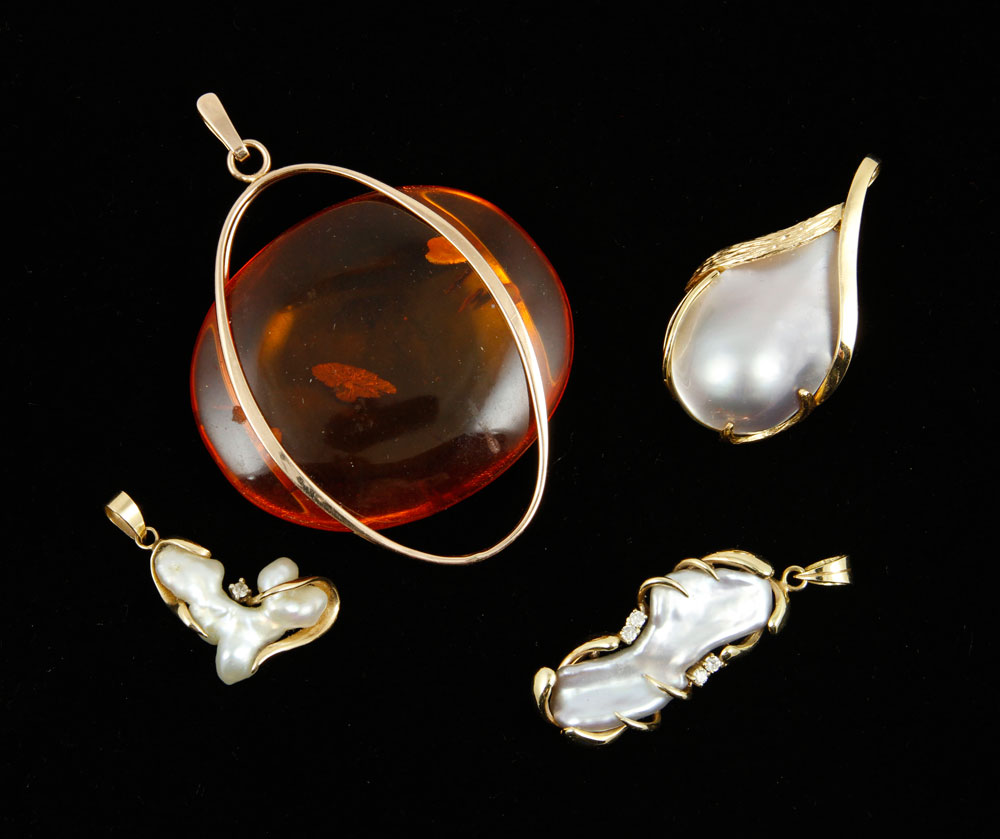 Appraisal: - K Gold Pendants Group of four K gold pendants