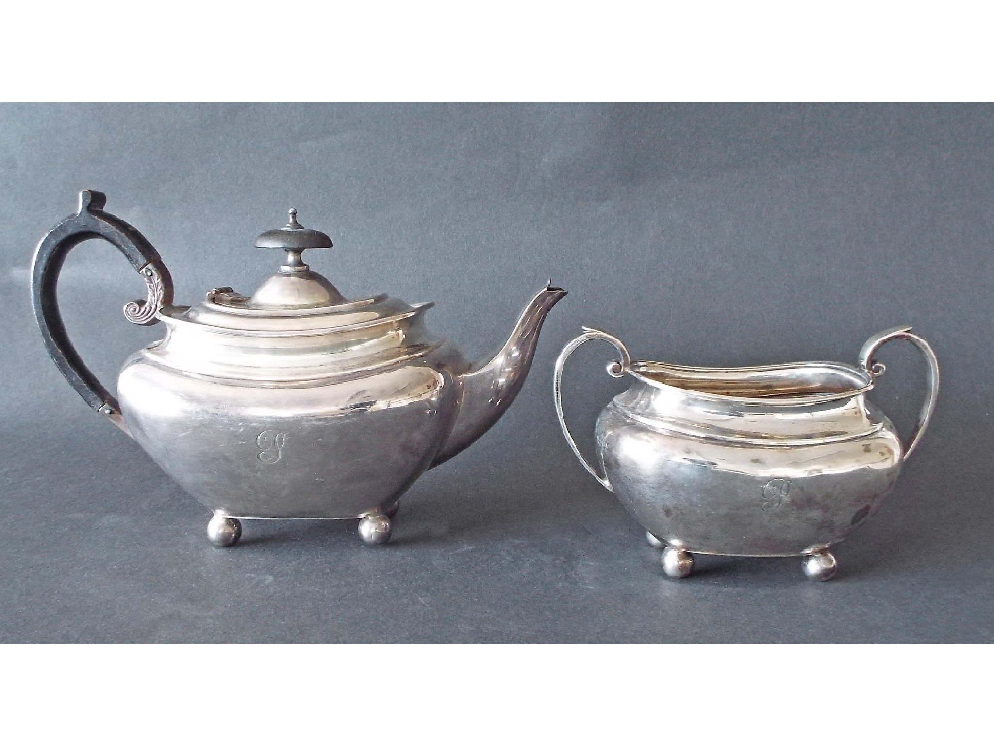 Appraisal: Silver bachelor boat shaped teapot and sucrier maker James Dixon