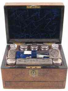 Appraisal: A walnut dressing case with jewellery drawer fully fitted with