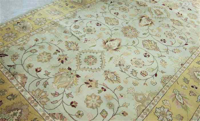 Appraisal: HAND KNOTTED ORIENTAL CARPET Indo-Persian scrolling floral vine decoration on