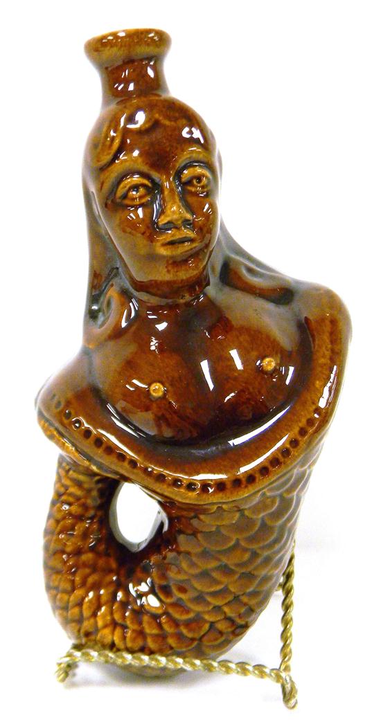 Appraisal: th C Rockingham type figural pottery flask bare-breasted mermaid tail