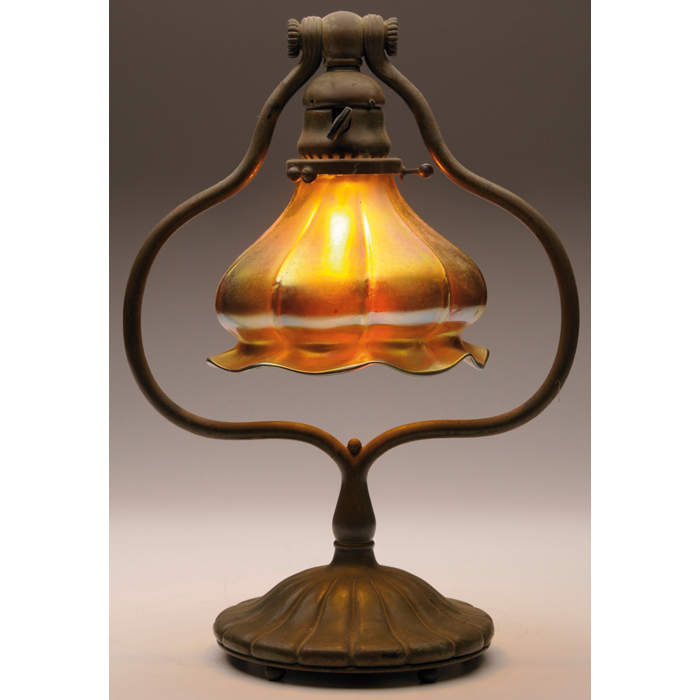 Appraisal: Tiffany Studios lamp bronze harp base holding a Steuben shade