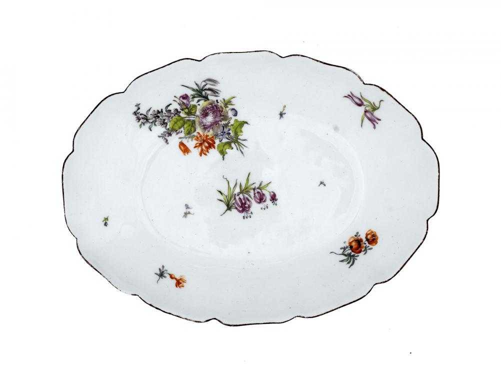 Appraisal: A CHELSEA DISH OR STAND painted with a loose bouquet