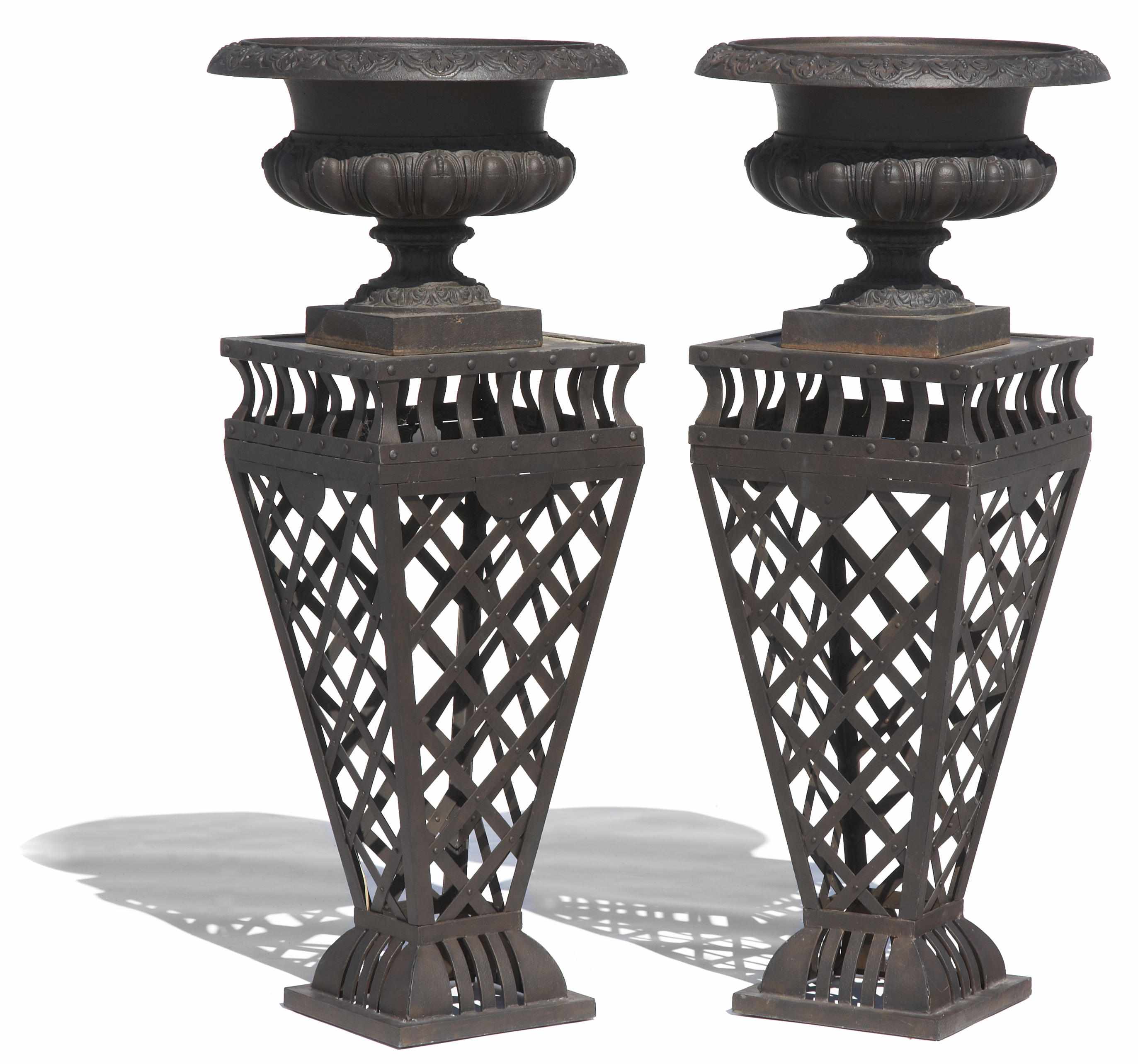 Appraisal: A pair of Neoclassical style cast iron jardinires on patinated