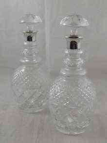 Appraisal: A pair of modern silver mounted glass decanters each approx