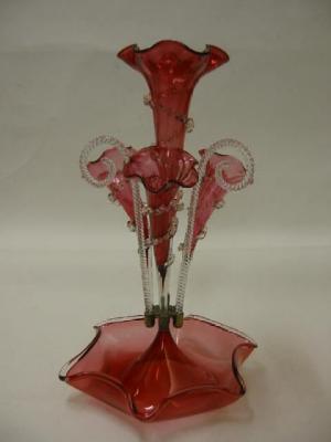 Appraisal: A CRANBERRY GLASS EPERGNE comprising one large central trumpet surrounded