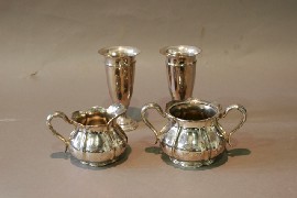 Appraisal: A silver plated sugar bowl creamer and two vases