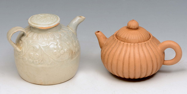 Appraisal: A CHINESE YUAN TYPE DING WARE TEAPOT with relief moulded