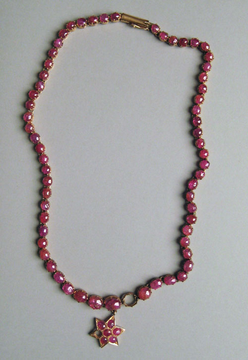 Appraisal: K yellow gold ruby necklace with graduated sized ruby cabochons