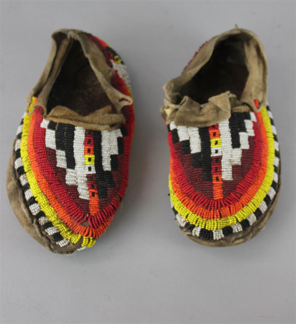 Appraisal: PAIR OF NATIVE AMERICAN BEADED HIDE MOCCASINS Provenance a Virginia