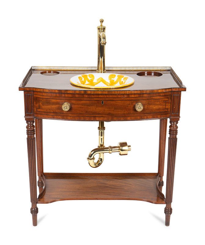 Appraisal: A Regency Style Mahogany Washstand with Brass Fixtures and Italian