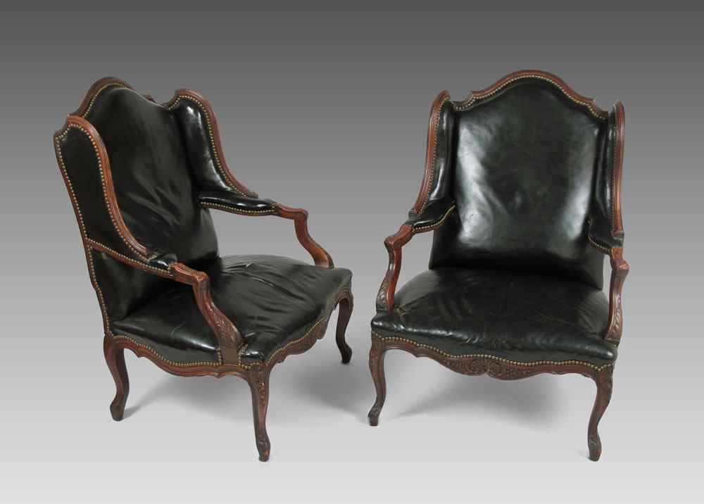 Appraisal: PAIR OF BLACK LEATHER OPEN ARM LIBRARY CHAIRS Shaped top