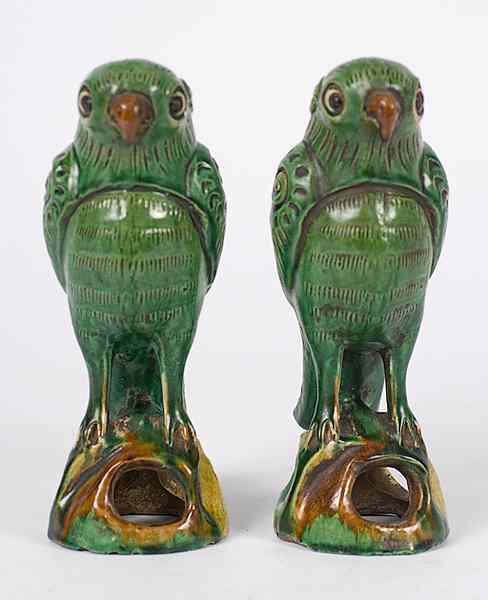 Appraisal: Sancai-style Ceramic Parrots Chinese a pair of sancai-style ceramic parrots