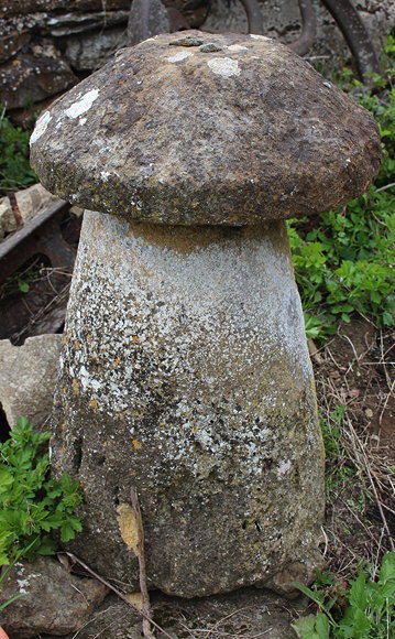 Appraisal: AN OLD STADDLE STONE with circular top and circular spreading