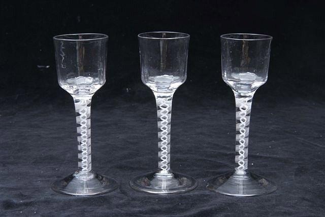 Appraisal: A SET OF THREE OGEE SHAPED WINE GLASSES with double