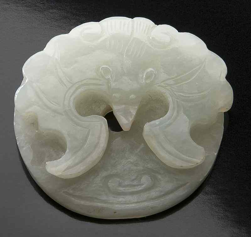 Appraisal: Chinese Qing carved white jade bi-diskone side depicting a bat