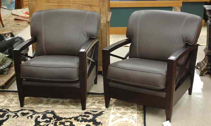 Appraisal: RECENT PAIR OF LEATHER AND DARK WOOD ARMCHAIRS unknown maker