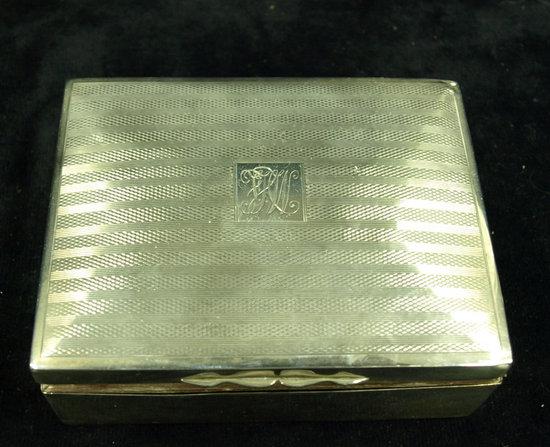 Appraisal: A rectangular cigarette box the engine turned cover monogrammed Birmingham