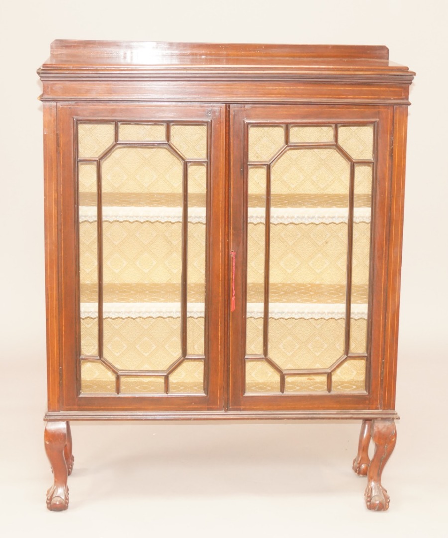 Appraisal: An Edwardian mahogany and boxwood strung display cabinet with two