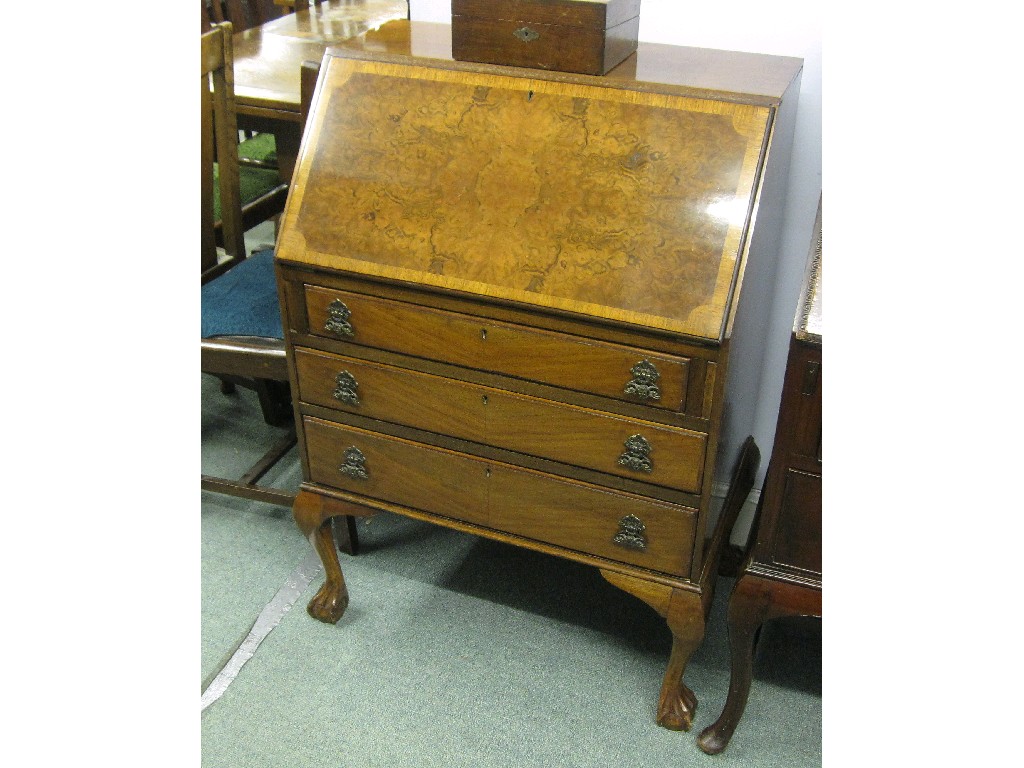 Appraisal: Walnut veneered slope front writing bureau