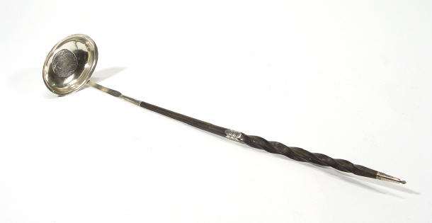 Appraisal: Unmarked early th Century silver sauce ladle with a horn