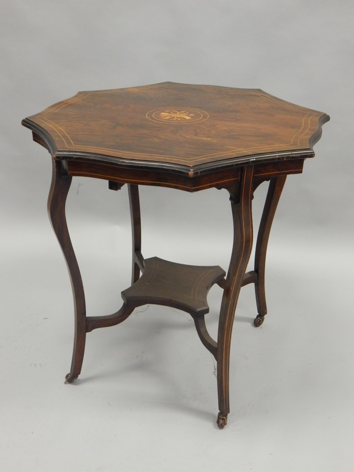 Appraisal: An Edwardian rosewood and marquetry occasional table with a shaped