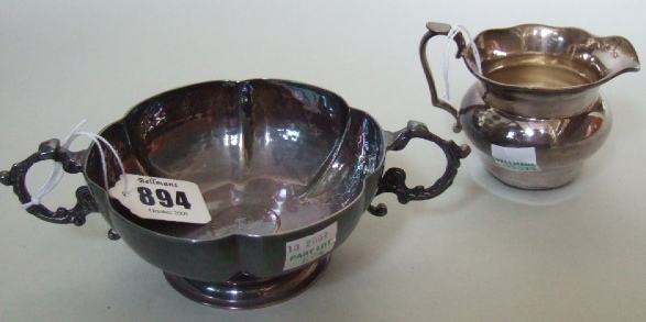 Appraisal: A silver twin handled bonbon bowl of panelled form with