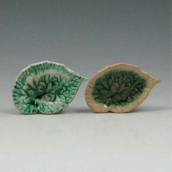 Appraisal: Two Majolica Begonia Leaf Butter Pats left marked with GSH