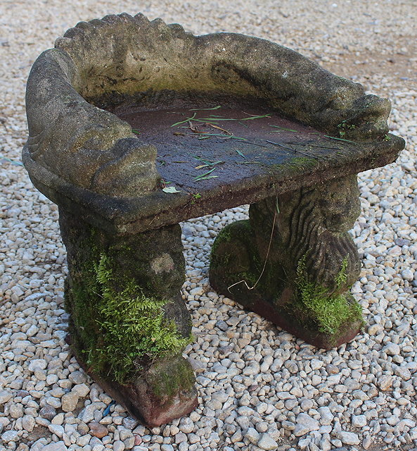 Appraisal: A SMALL ROMAN STYLE COMPOSITE STONE HORSESHOE SHAPED GARDEN SEAT