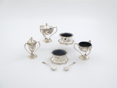 Appraisal: An Edwardian art nouveau piece condiment set with buttress supports