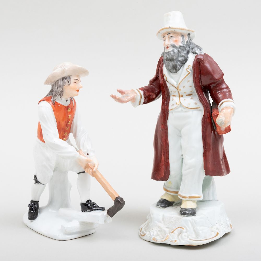 Appraisal: Staffordshire Figure of a Beggar and a Wood Splitter The