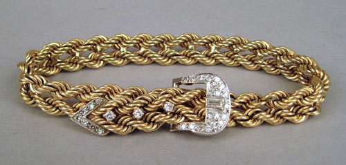 Appraisal: Double rope link K yellow gold bracelet with diamond encrusted